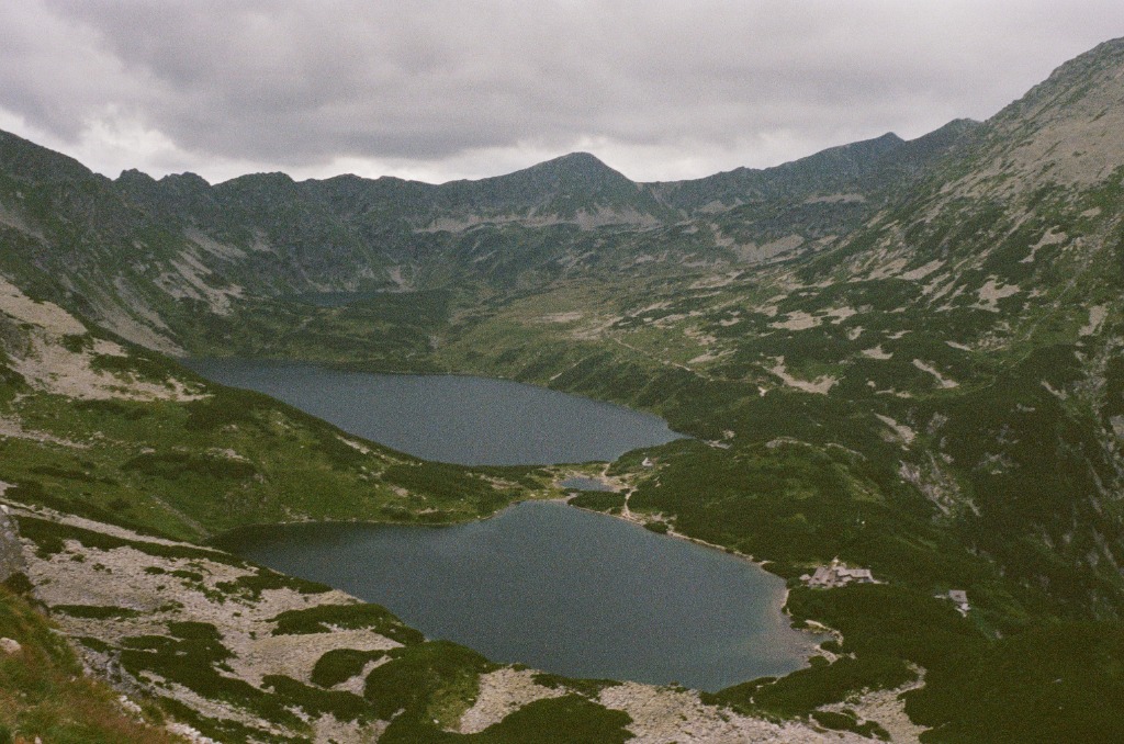 Two grey-blue mountain lakes nestled in a rocky circus.