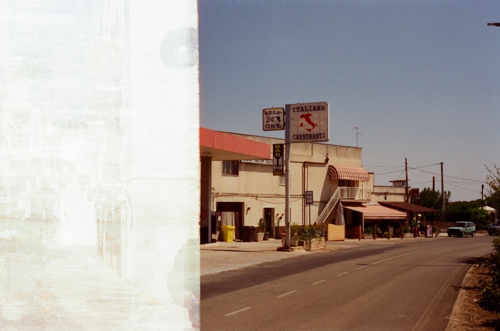 Vintage gas station overexposed on the left by a film effect.